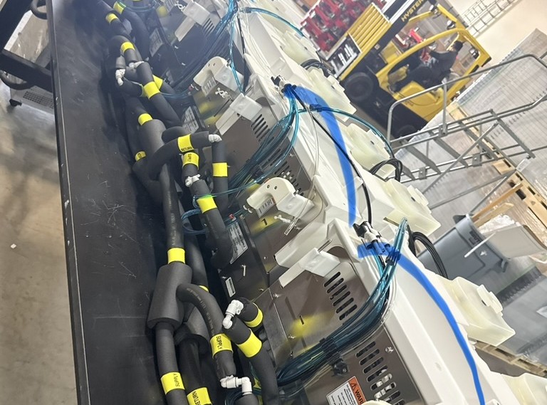 Cable and hose connections bundled and labeled during equipment prep at the NCS Oakland warehouse
